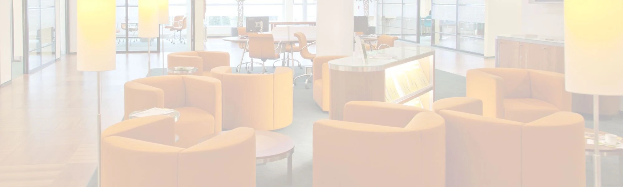 Modern lounge area with orange seating and sleek decor